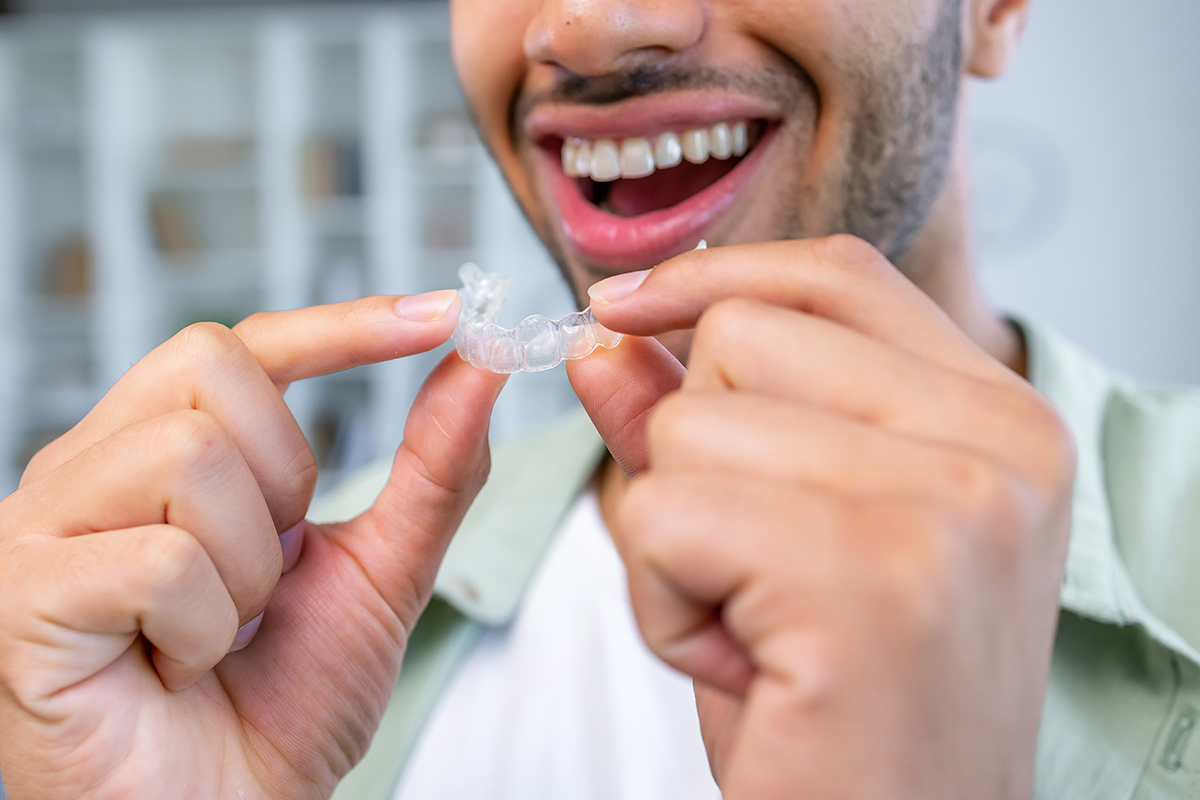 Encino man with Invisalign aligners in Encino.